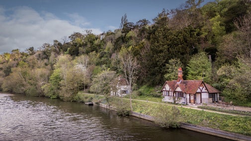 An aerial view of Cliveden Ferry Cottage, on the bank of the River Thames, Berkshire